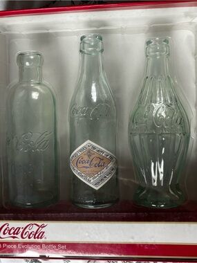 Coca-Cola 3-Piece Evolution Collectible Bottle Set never opened